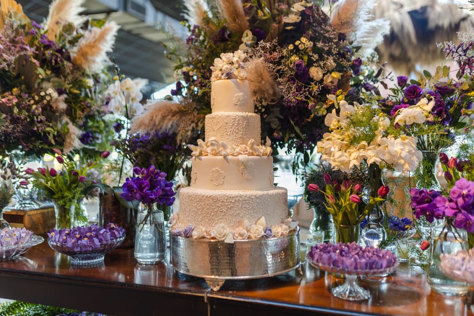 A wedding cake among flowers