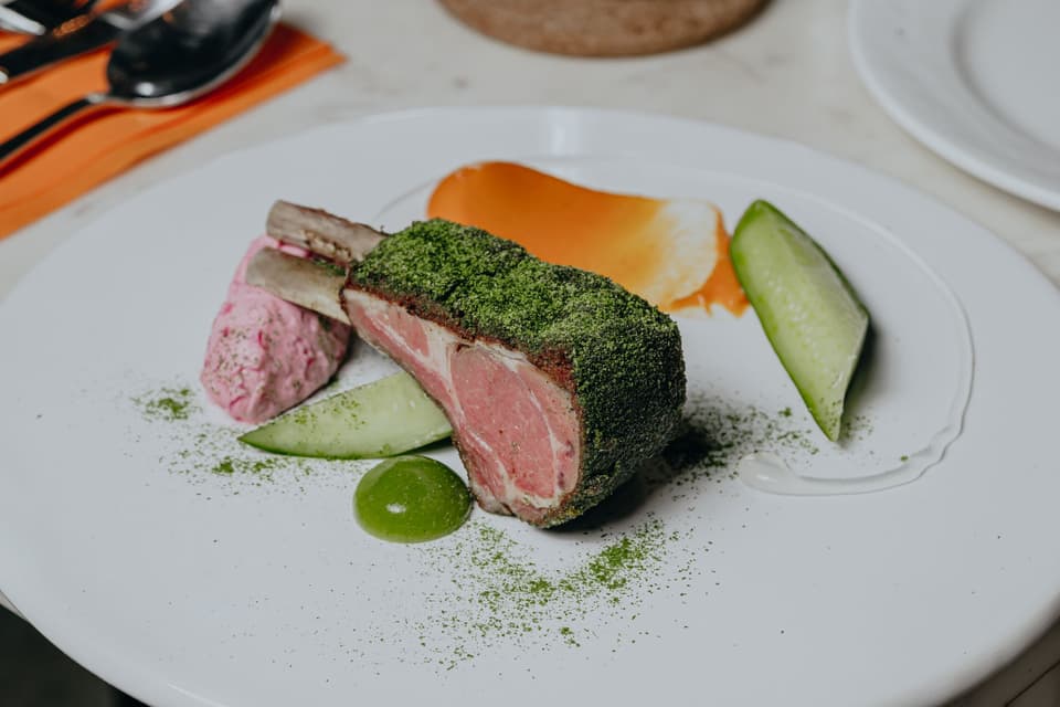 Herb-crusted lamb, plated