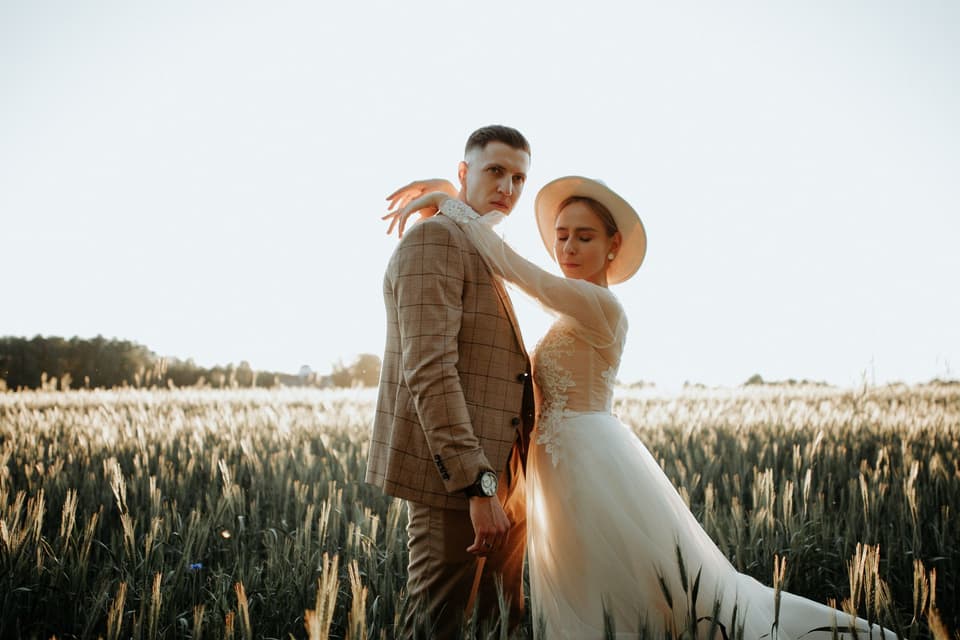 Anna and Mikael in the long grass at golden hour