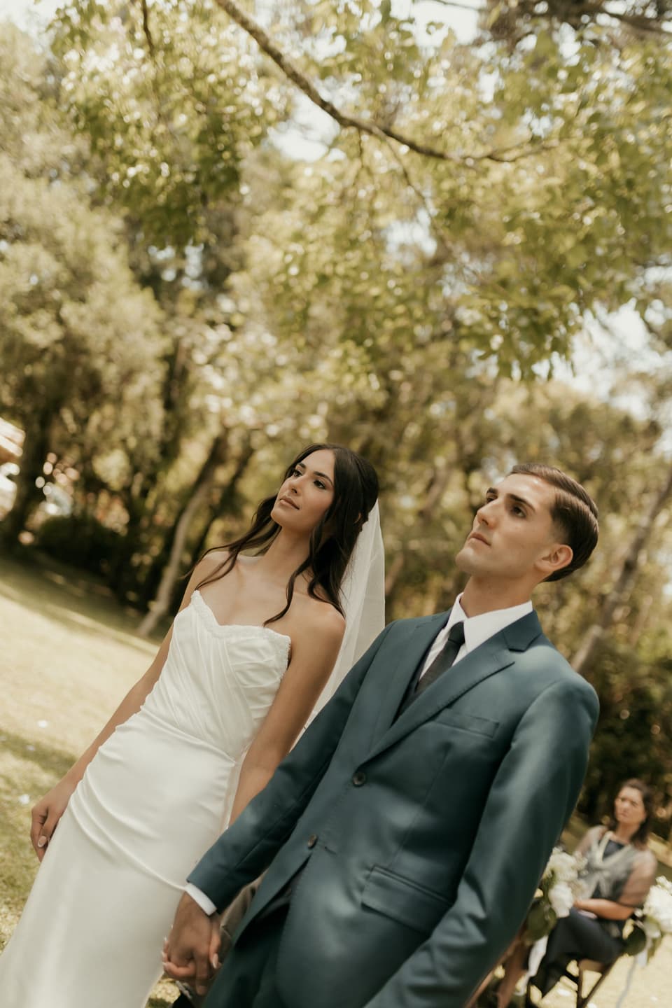 Sofia and Luca after the ceremony, under the trees